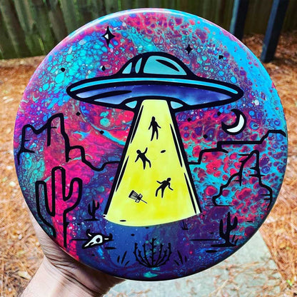 Custom UFO Disc Golf Disc in hand